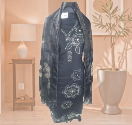 Black traditional embroidered salwar suit styled with a matching floral dupatta,